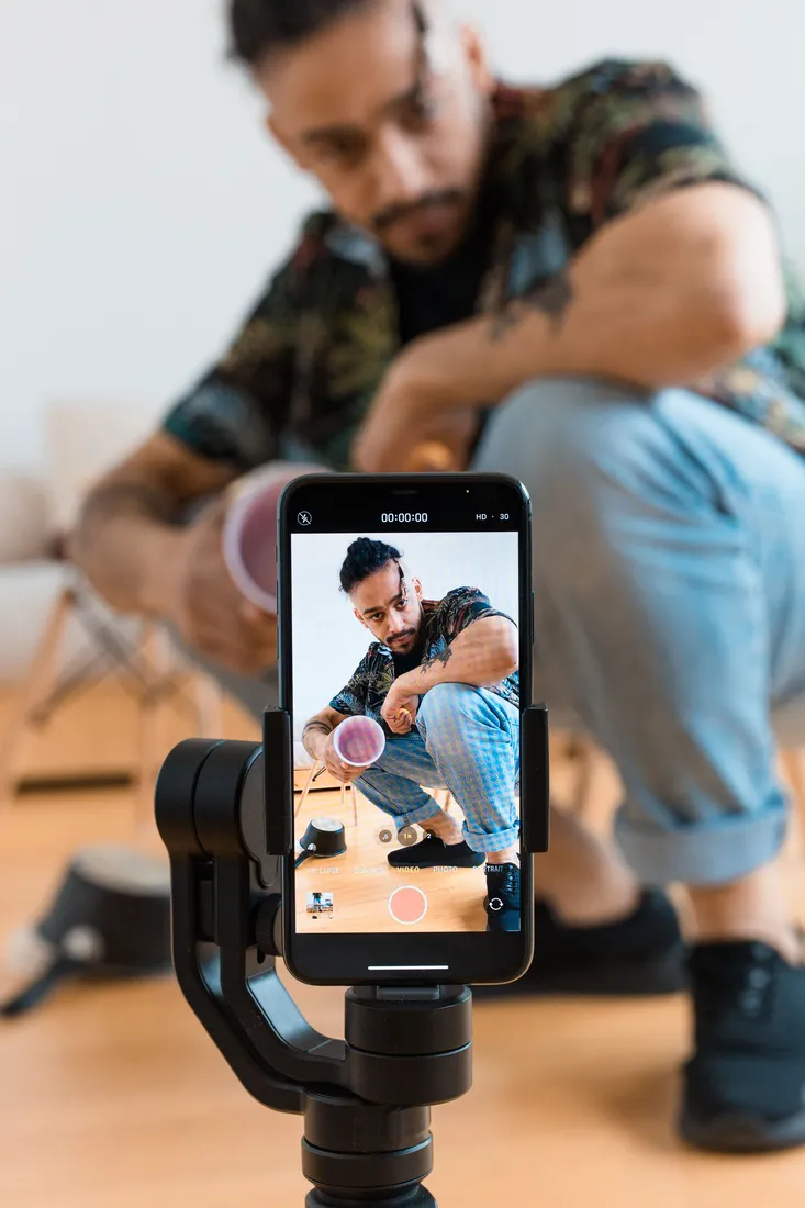 A creator filming a short-form video with a phone